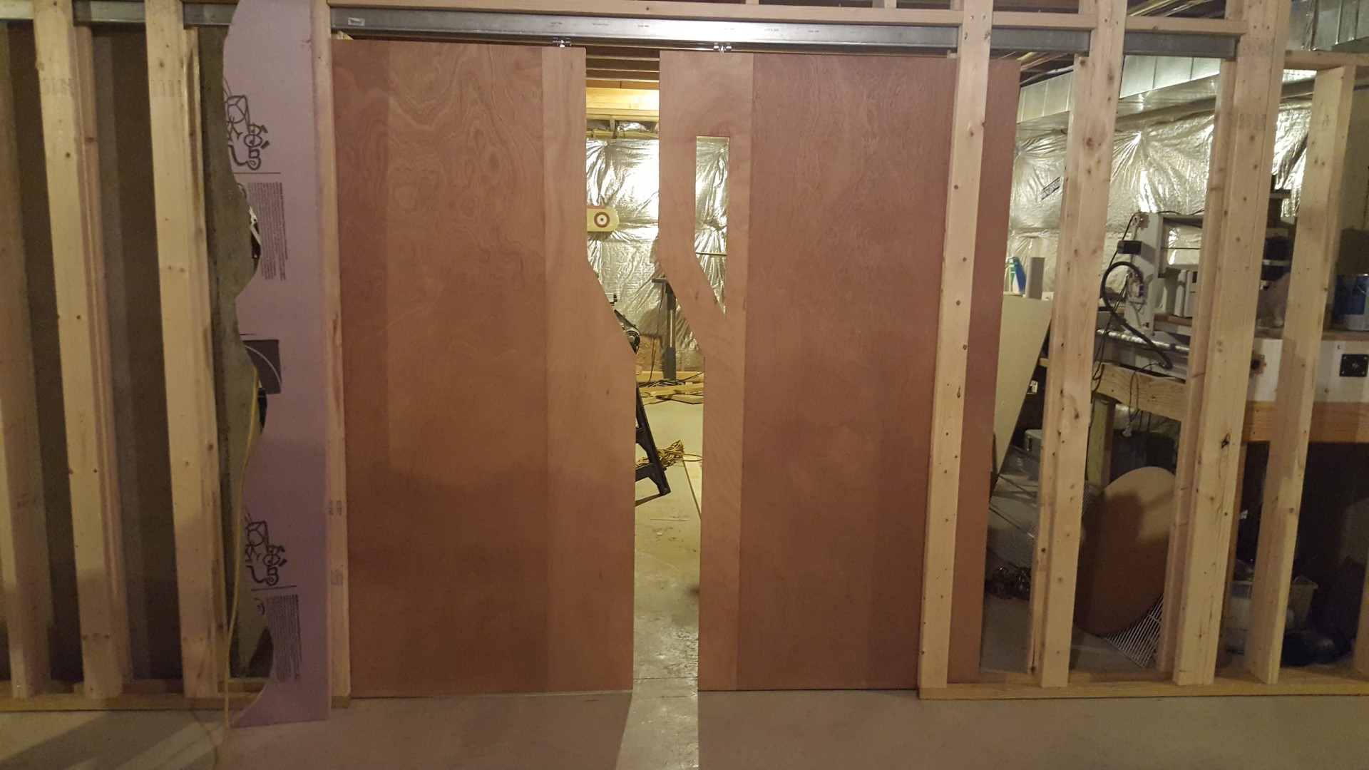 Three hollow core doors cut and glued together to look like a space ship air lock